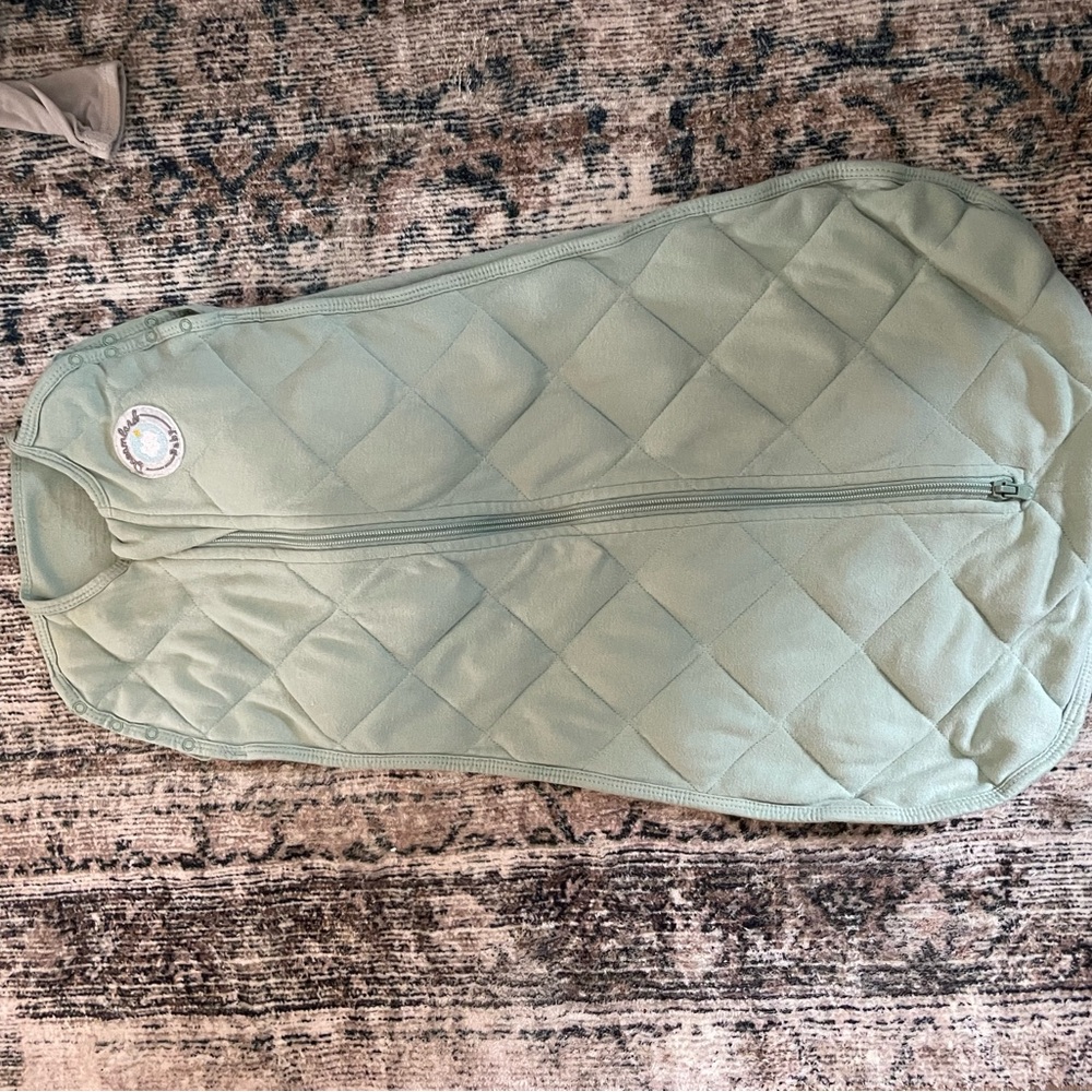 Dreamland baby green swaddle in size small.